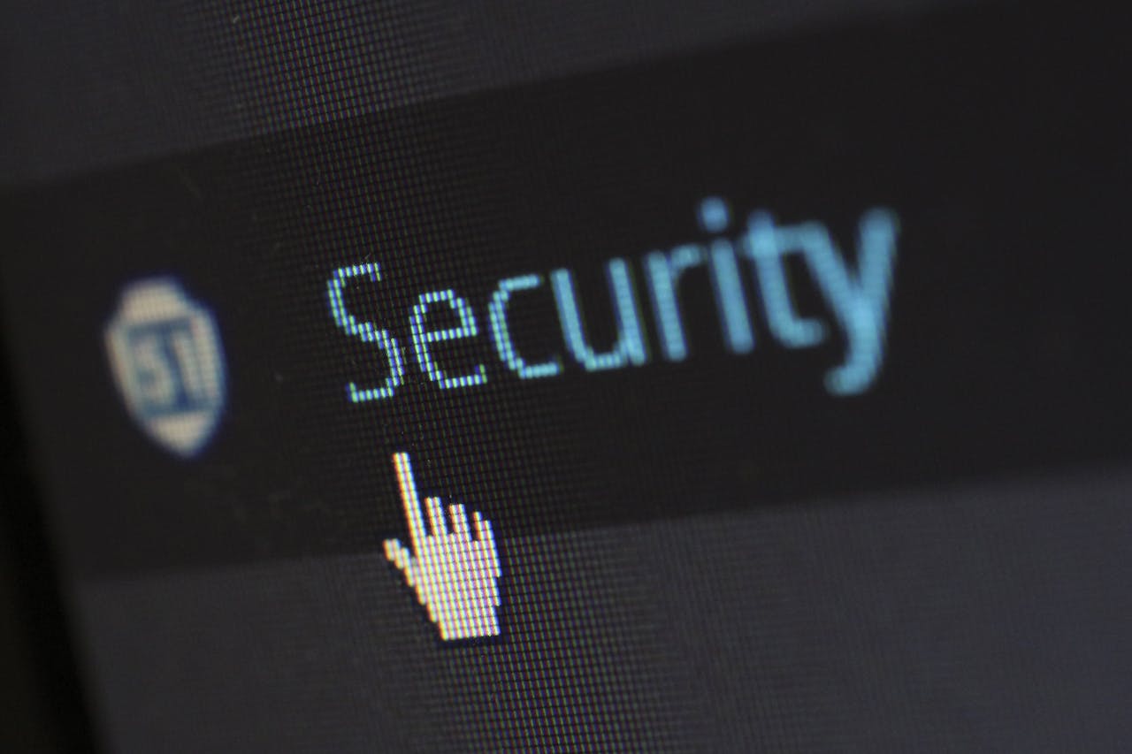 about-01 Close-up view of a mouse cursor over digital security text on display.